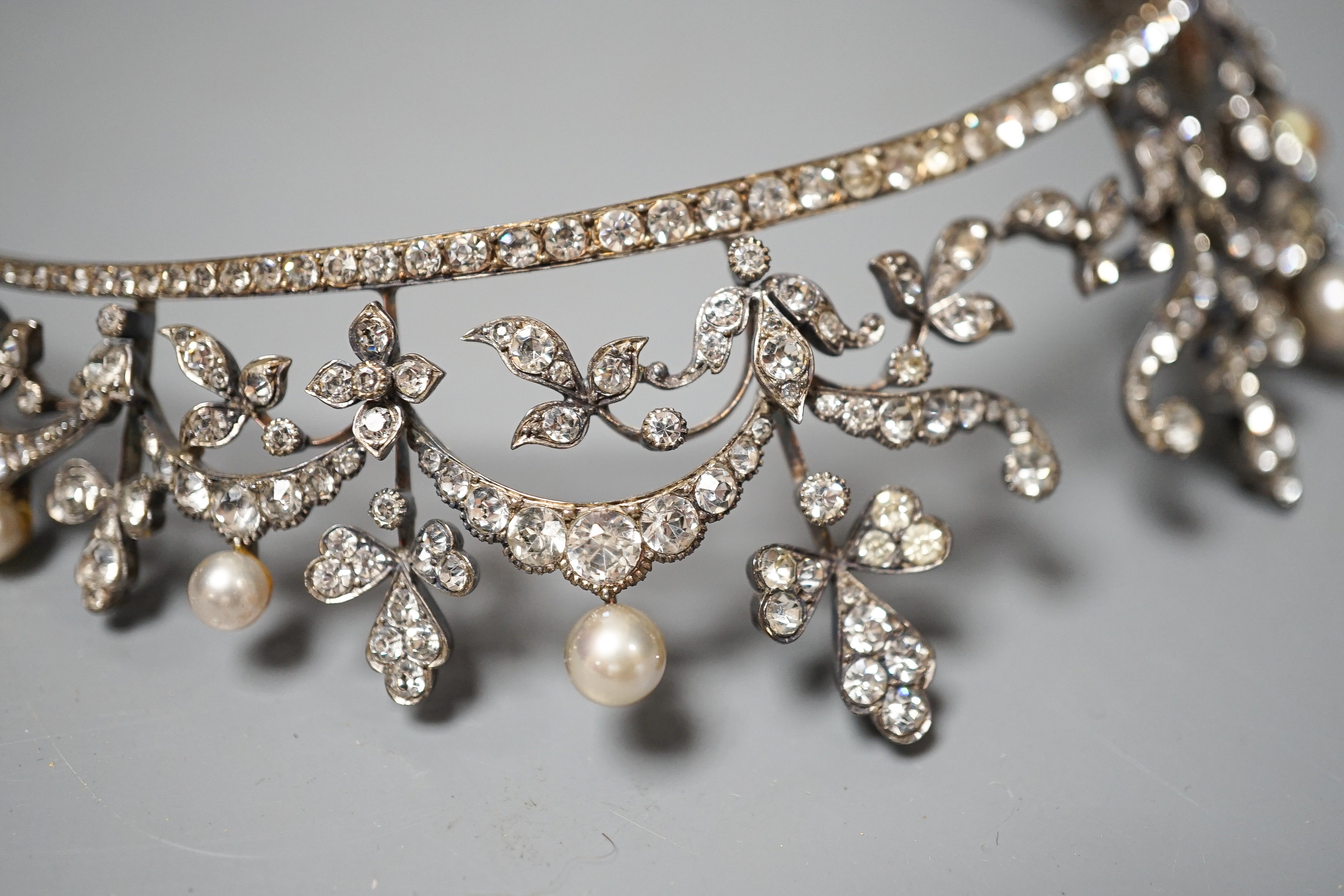 An Edwardian white metal and paste set tiara, 13cm.